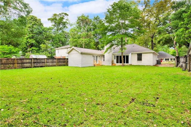 back of house featuring view of scattered trees