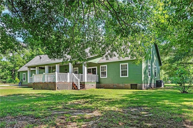 8255A Dixon Rd, Bay Minette, AL 36507 - view of front of property with crawl space, central AC unit, a front lawn, and covered porch