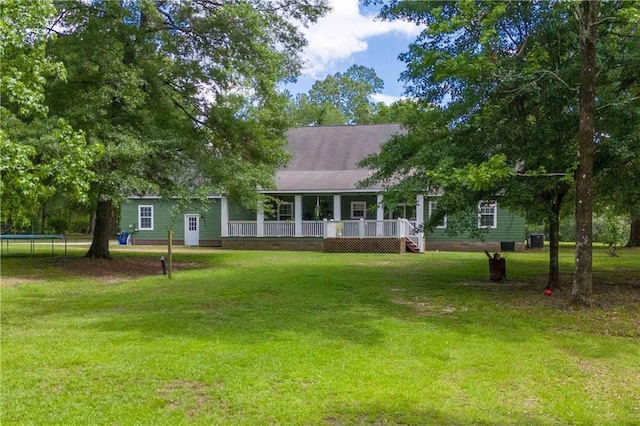 8255A Dixon Rd, Bay Minette, AL 36507 - back of house with a porch, a yard, and a trampoline