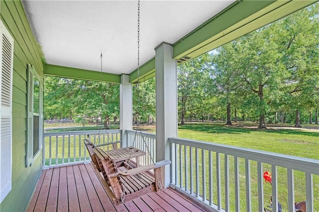 8255A Dixon Rd, Bay Minette, AL 36507 - wooden terrace with a porch, a lawn, and view of scattered trees