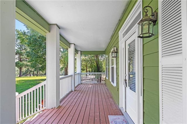 8255A Dixon Rd, Bay Minette, AL 36507 - deck featuring a porch and a yard
