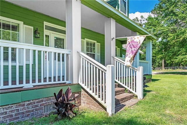 8255A Dixon Rd, Bay Minette, AL 36507 - wooden deck with covered porch and a yard
