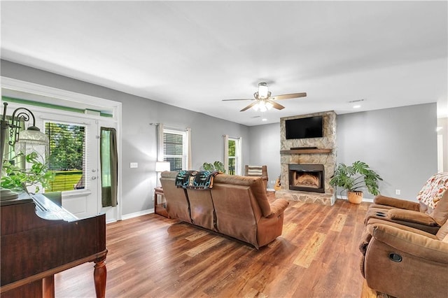 8255A Dixon Rd, Bay Minette, AL 36507 - living room featuring ceiling fan, baseboards, wood finished floors, and a fireplace