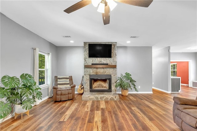 8255A Dixon Rd, Bay Minette, AL 36507 - living area with wood finished floors, a fireplace, baseboards, and recessed lighting