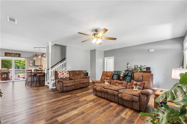 8255A Dixon Rd, Bay Minette, AL 36507 - living room with dark wood-type flooring, stairs, and ceiling fan