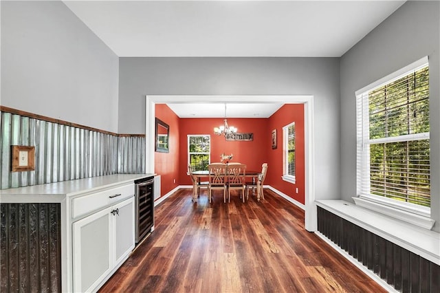 8255A Dixon Rd, Bay Minette, AL 36507 - dining area with beverage cooler, dark wood-type flooring, a chandelier, and baseboards