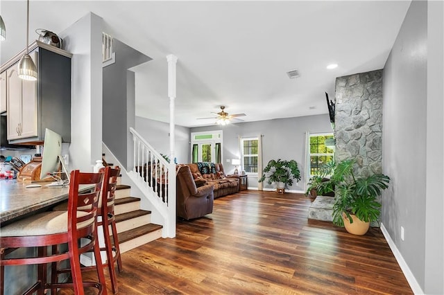 8255A Dixon Rd, Bay Minette, AL 36507 - living area with stairway, wood finished floors, a ceiling fan, and baseboards