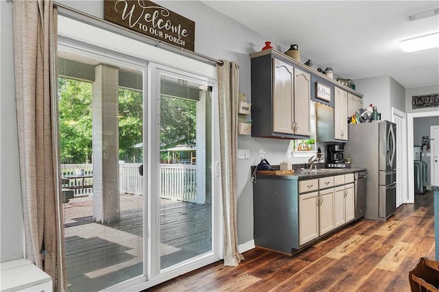8255A Dixon Rd, Bay Minette, AL 36507 - kitchen with dishwasher, dark countertops, dark wood-type flooring, and a sink