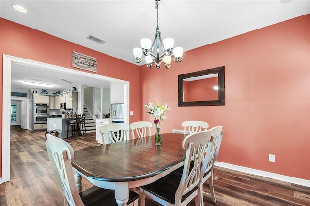 8255A Dixon Rd, Bay Minette, AL 36507 - dining area featuring dark wood-type flooring, baseboards, a chandelier, stairs, and recessed lighting