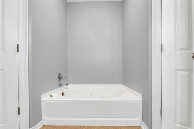 8255A Dixon Rd, Bay Minette, AL 36507 - full bath with a tub with jets, tile patterned floors, and baseboards