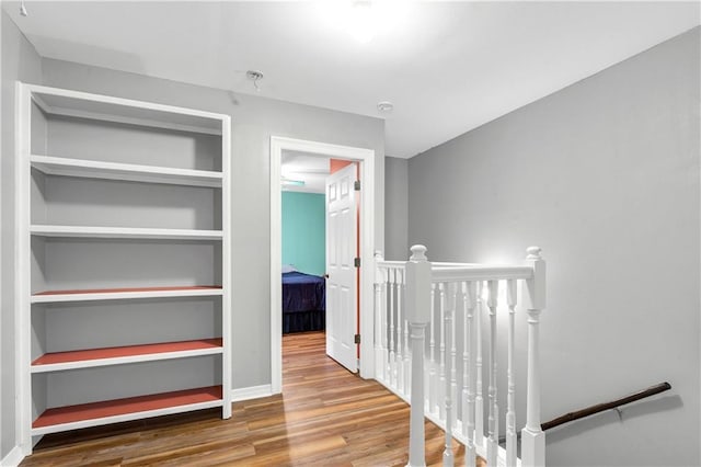 8255A Dixon Rd, Bay Minette, AL 36507 - hall with an upstairs landing, wood finished floors, and baseboards