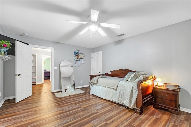 8255A Dixon Rd, Bay Minette, AL 36507 - bedroom with baseboards, wood finished floors, and a ceiling fan