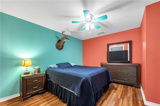 8255A Dixon Rd, Bay Minette, AL 36507 - bedroom featuring wood finished floors, baseboards, and a ceiling fan