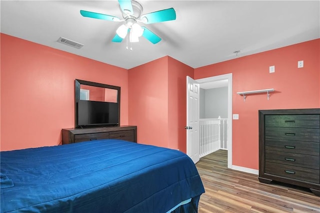 8255A Dixon Rd, Bay Minette, AL 36507 - bedroom featuring wood finished floors, baseboards, and a ceiling fan