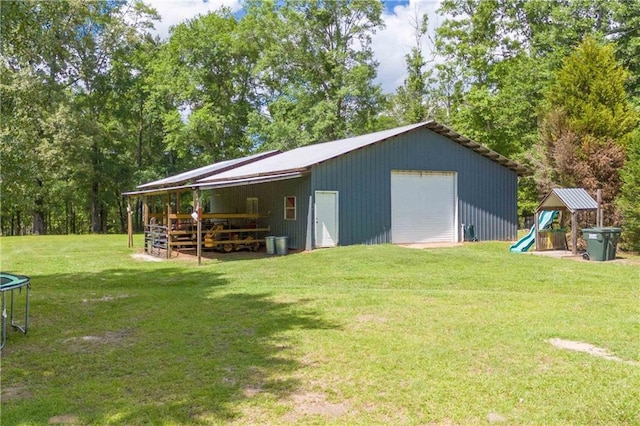 8255A Dixon Rd, Bay Minette, AL 36507 - view of outbuilding featuring an outbuilding, a trampoline, and a playground