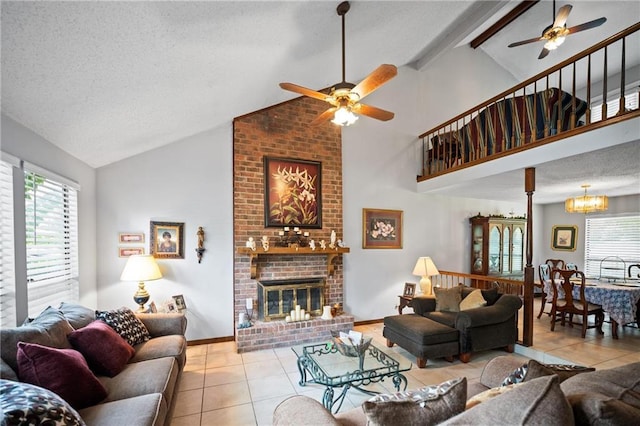 112 Broadmoor Dr, Daphne, AL 36526 - tiled living area featuring a ceiling fan, a textured ceiling, a fireplace, beam ceiling, and high vaulted ceiling