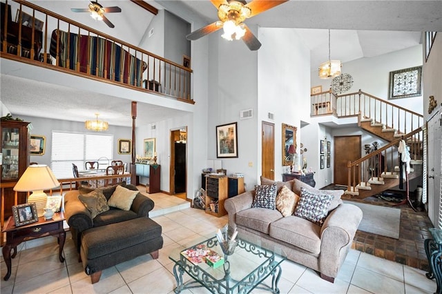 112 Broadmoor Dr, Daphne, AL 36526 - living area with a ceiling fan, a chandelier, stairway, high vaulted ceiling, and tile patterned floors