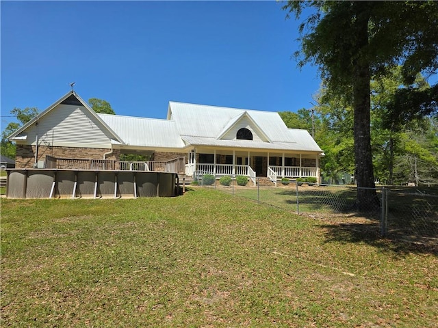 9075 Hamm Cir, Wilmer, AL 36587 - back of property with metal roof and stone siding