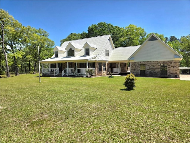 9075 Hamm Cir, Wilmer, AL 36587 - view of front of home with a porch, a front lawn, and metal roof