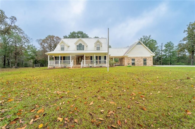 view of front of home with covered porch and a front lawn