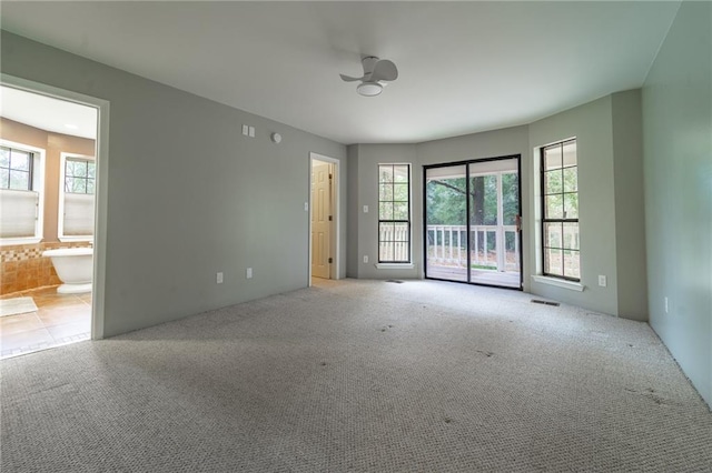 9075 Hamm Cir, Wilmer, AL 36587 - empty room with ceiling fan and carpet flooring
