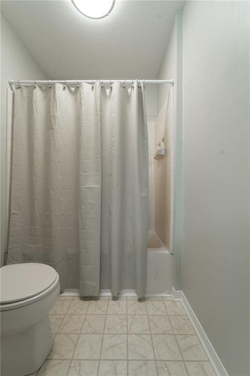 bathroom with toilet and shower / bath combination with curtain