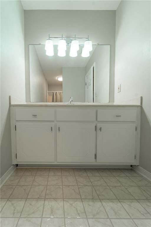 9075 Hamm Cir, Wilmer, AL 36587 - bathroom featuring marble finish flooring, baseboards, and a sink