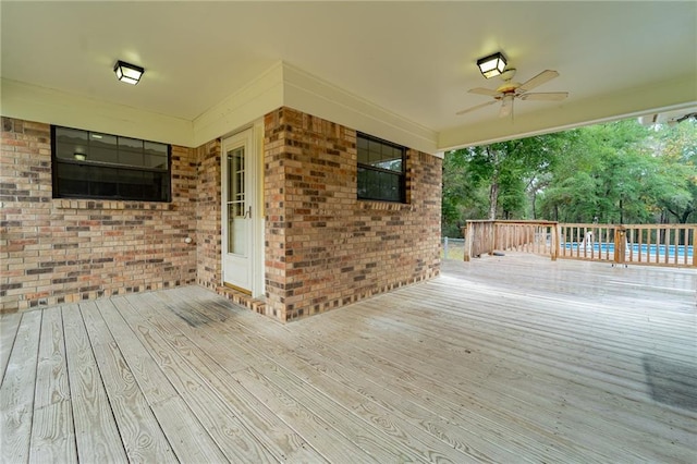 wooden deck with ceiling fan