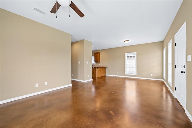 unfurnished living room featuring ceiling fan