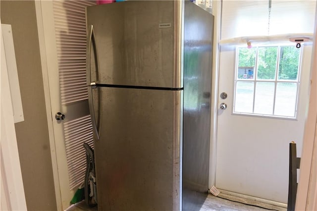 laundry area with light hardwood / wood-style flooring