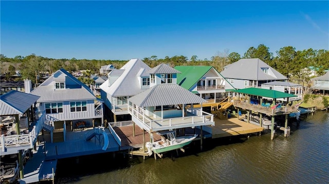 dock area with a residential view and a water view