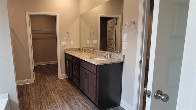 bathroom featuring vanity and hardwood / wood-style floors