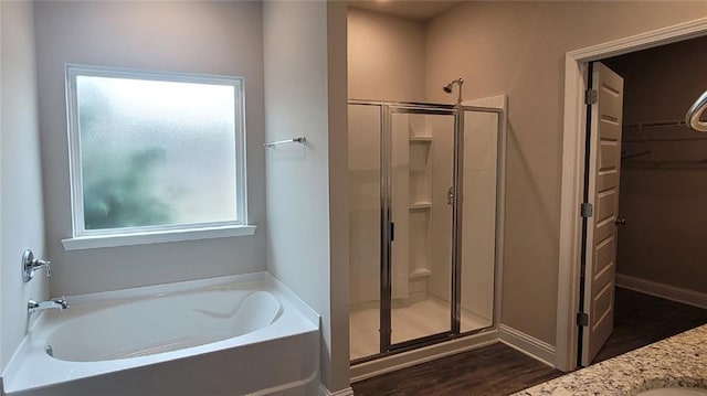 bathroom featuring vanity, hardwood / wood-style flooring, and separate shower and tub