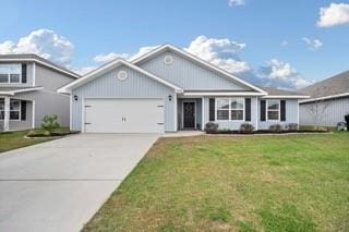 view of front of home with a garage, driveway, and a front yard