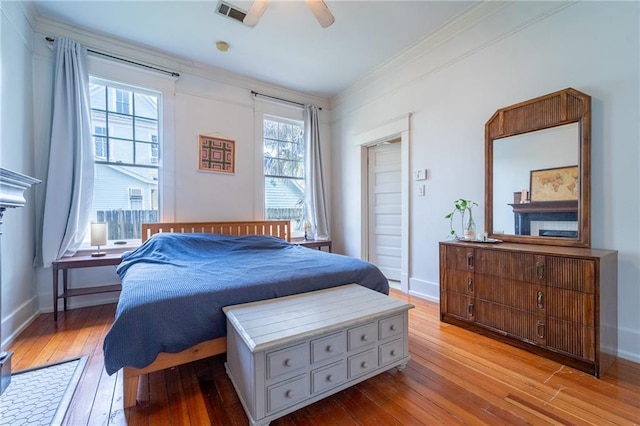 7 Reed Ave N, Mobile, AL 36604 - bedroom with wood-type flooring, crown molding, baseboards, and ceiling fan