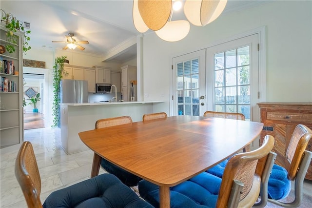 7 Reed Ave N, Mobile, AL 36604 - dining space featuring french doors, light marble finish flooring, ceiling fan, and ornamental molding