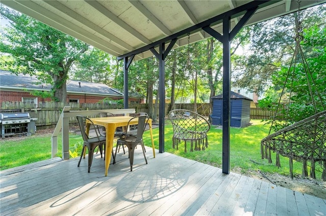 7 Reed Ave N, Mobile, AL 36604 - wooden terrace with outdoor dining area and a grill