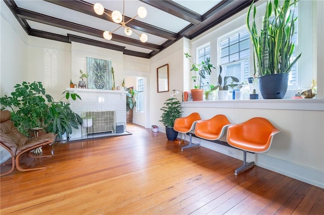 7 Reed Ave N, Mobile, AL 36604 - sitting room with wood-type flooring, beamed ceiling, a fireplace, and baseboards