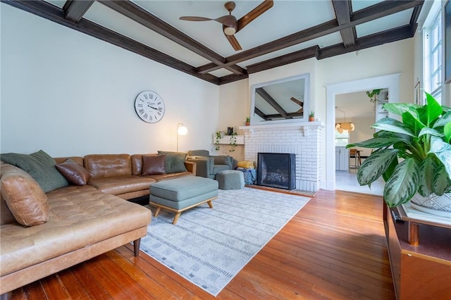 7 Reed Ave N, Mobile, AL 36604 - living room with coffered ceiling, ceiling fan, hardwood / wood-style flooring, beamed ceiling, and a brick fireplace