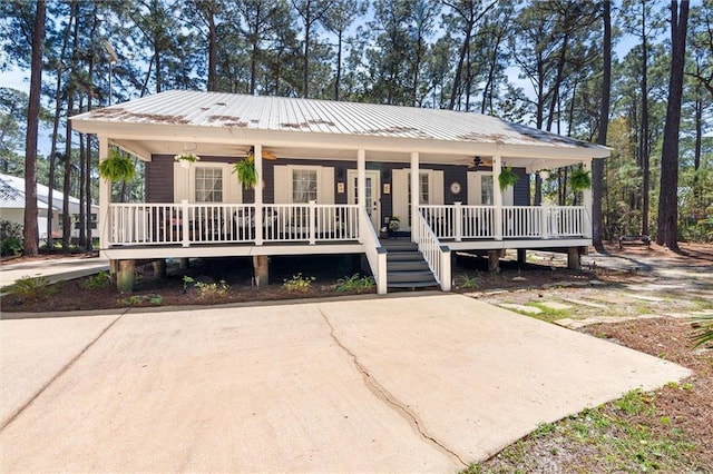 901 La Mothe Pl, Dauphin Island, AL 36528 - view of front of house with metal roof, covered porch, and a ceiling fan