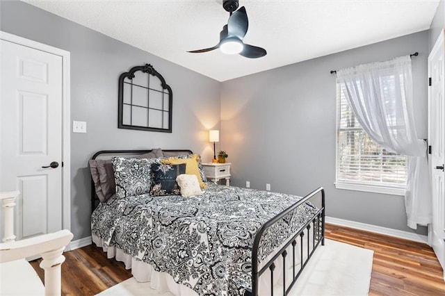 901 La Mothe Pl, Dauphin Island, AL 36528 - bedroom featuring wood finished floors, baseboards, and ceiling fan