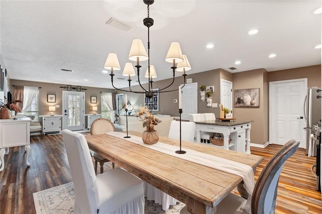 901 La Mothe Pl, Dauphin Island, AL 36528 - dining room featuring an inviting chandelier, recessed lighting, wood finished floors, and visible vents