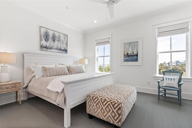 2455 Saltgrass Way, Orange Beach, AL 36561 - bedroom with crown molding, baseboards, dark wood-style floors, and ceiling fan