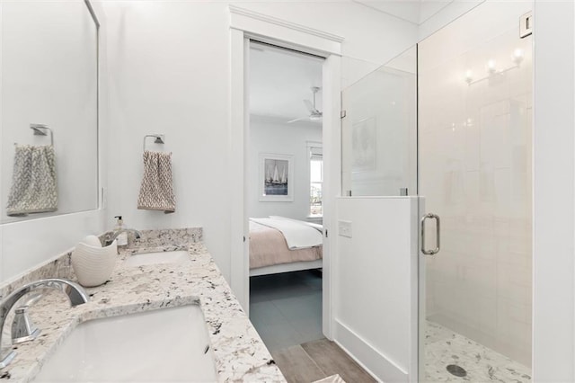 2455 Saltgrass Way, Orange Beach, AL 36561 - bathroom with a stall shower, connected bathroom, and double vanity