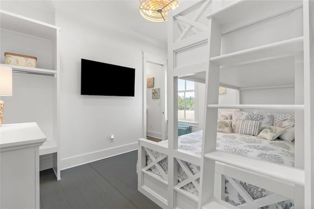 2455 Saltgrass Way, Orange Beach, AL 36561 - bedroom featuring dark wood finished floors and baseboards
