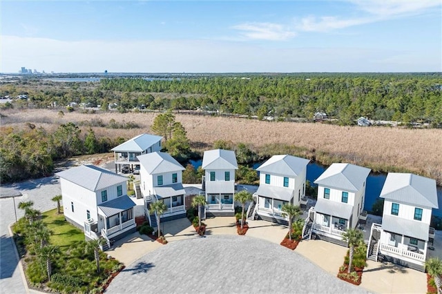 2455 Saltgrass Way, Orange Beach, AL 36561 - aerial view of residential area featuring a forest