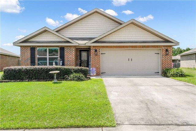 view of front facade with a garage and a front yard