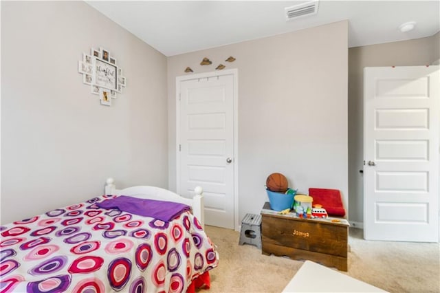 bedroom with light carpet