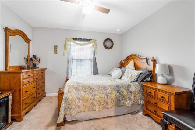 bedroom featuring ceiling fan and light colored carpet