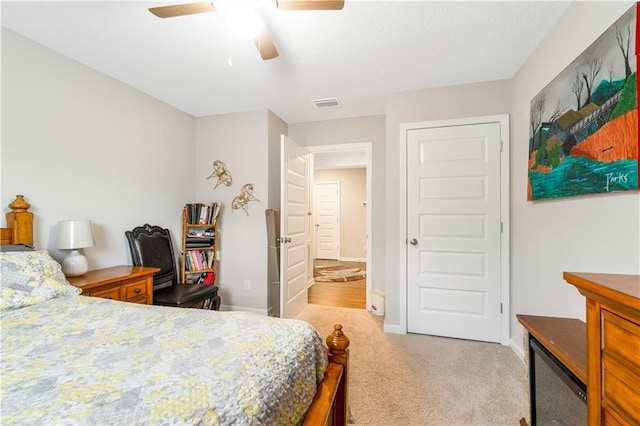 carpeted bedroom featuring ceiling fan